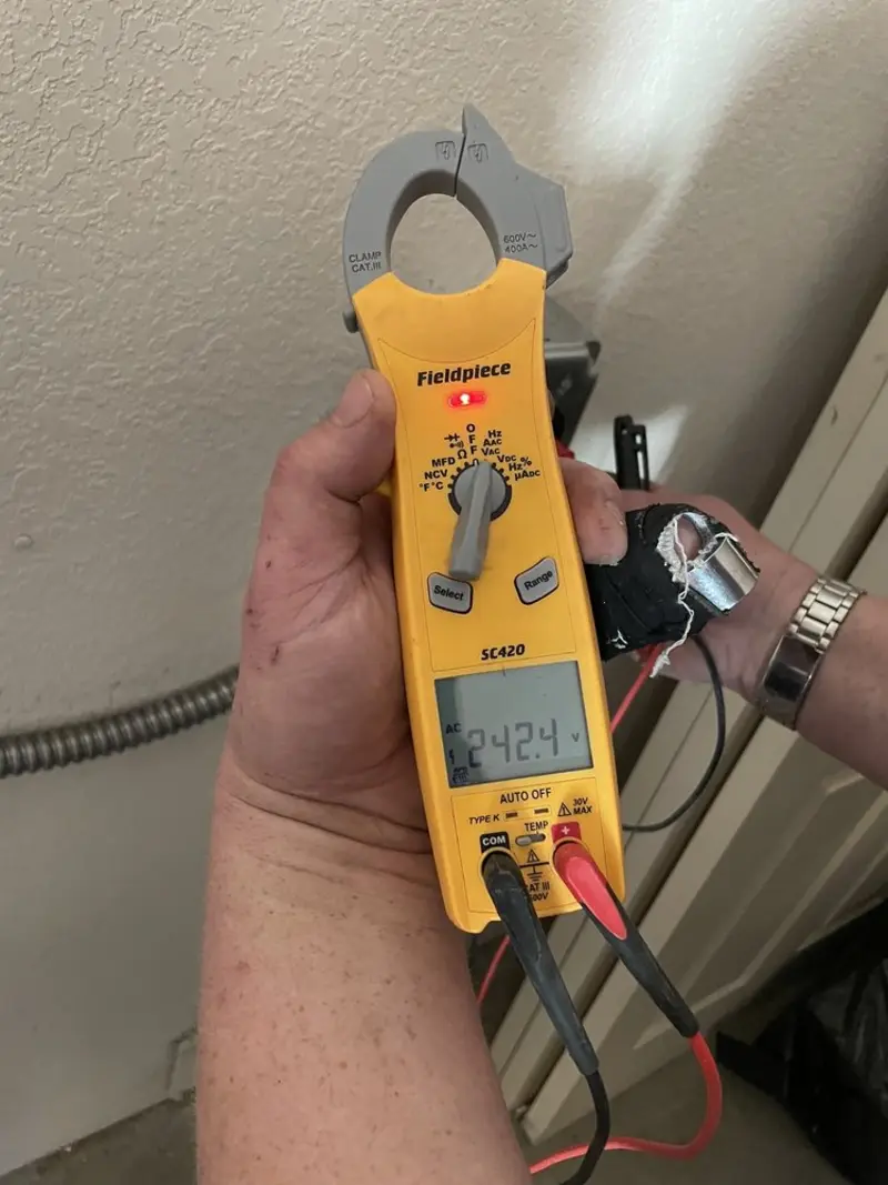 Voltage testing with clamp meter during Outlet Installation in Butler